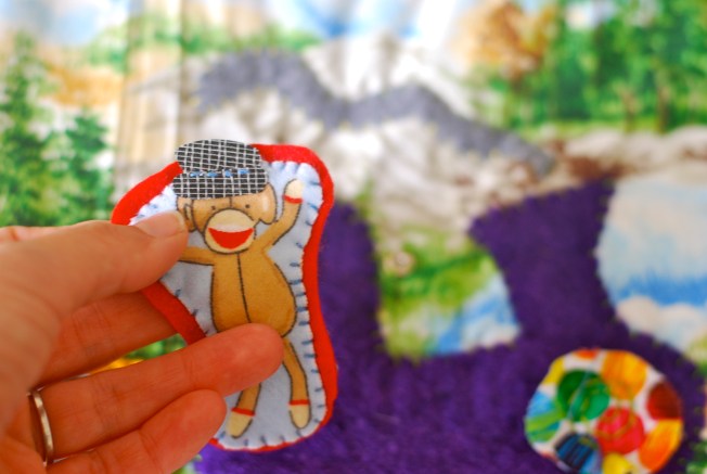 sock monkey train conductor